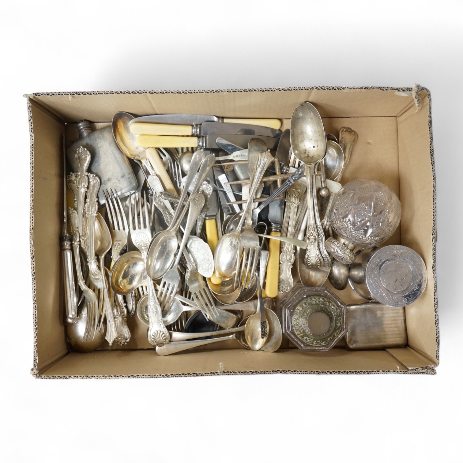A pair of Victorian silver King's pattern table spoons by George Adams, London, 1858, a silver teaspoon, a mounted glass scent bottle, a silver cigarette case, a continental canister with inset coin lid, and assorted pla
